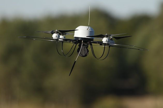 A small surveillance drone flies during the annual military exercises held for the media at the Bergen military training grounds on October 2, 2013 near Munster, Germany.